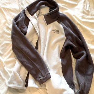White and grey North Face zip-up jacket